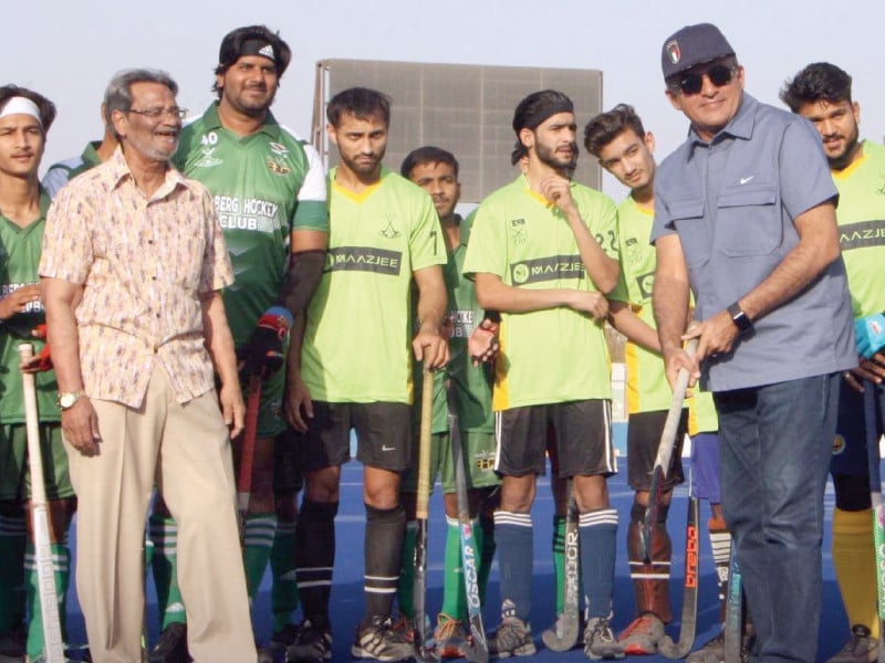 president kha syed imtiaz ali shah opens kha ramadan inter club hockey 2025 by hitting a ball as ex olympian hanif khan and the players look on photo kha