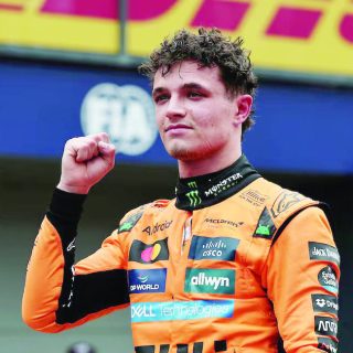 mclaren s lando norris celebrates after qualifying in pole position in the formula one australian grand prix qualifying at albert park grand prix circuit in melbourne on march 15 photo reuters