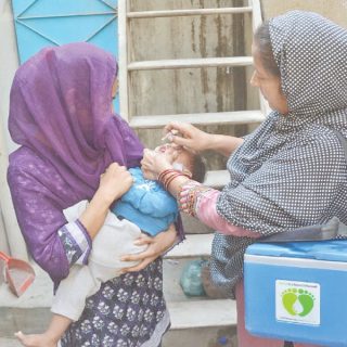 a health worker administers anti polio drops to a child marking the launch of the latest anti polio campaign in the city photo jalal qureshi express