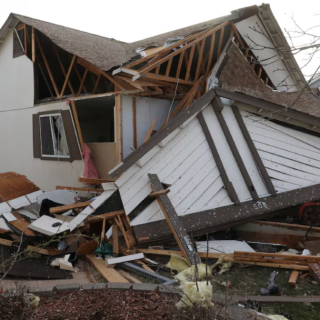 debris lies around a damaged home the morning after a tornado touched down in florissant missouri us march 15 2025 photo reuters