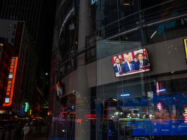 photo television show us president donald trump s address to a joint session of congress at the nasdaq marketplace in times square in new york city us